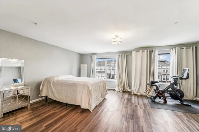 a room with a desk and gym equipment