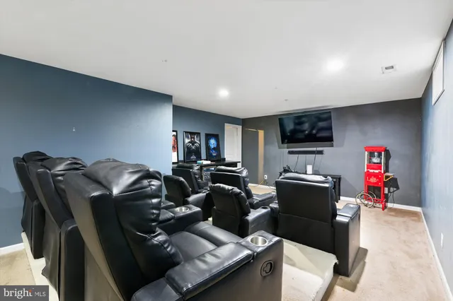 a bathroom with a sink mirror and toilet
