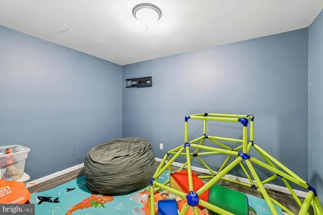 a view of a house with a big yard and large trees