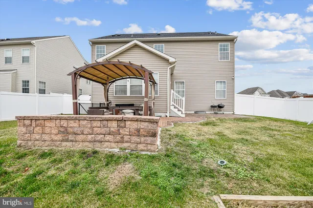a view of a swimming pool with an outdoor space and seating area