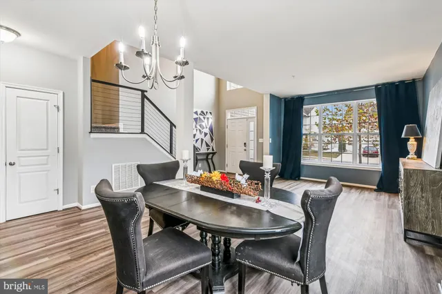a view of a dining room with furniture and window
