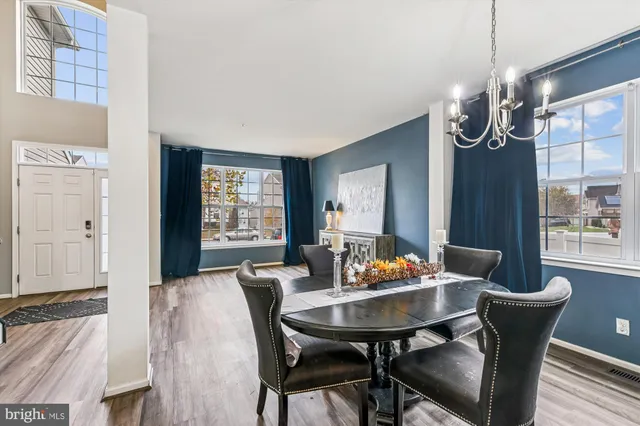 a kitchen with kitchen island granite countertop a sink stove and refrigerator
