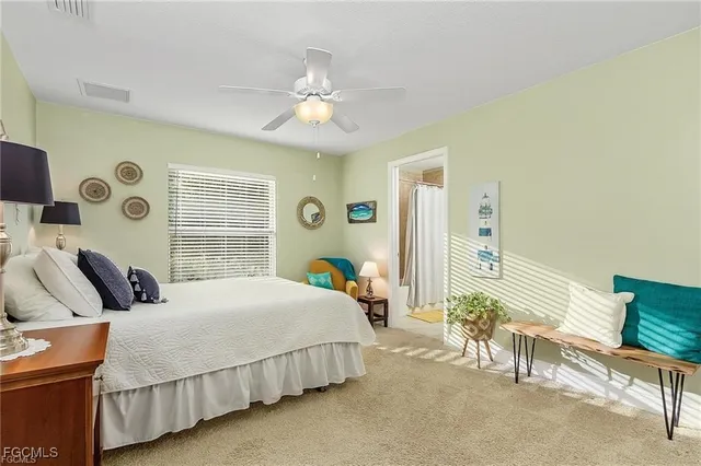 a bedroom with bed and a window