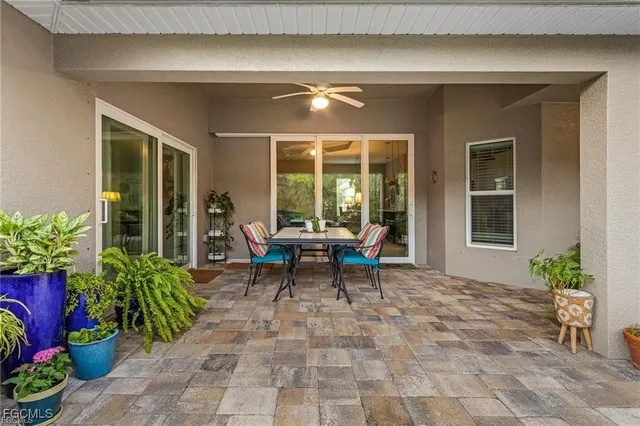 a balcony with furniture and flowers