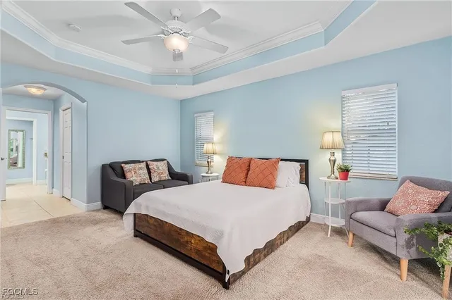 a spacious bedroom with a bed and window