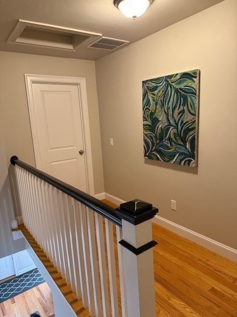 176 Main Street, Unit 3 Medway, MA 02053 - Photo 16 of 26 a view of a hallway with wooden floor and a ceiling fan