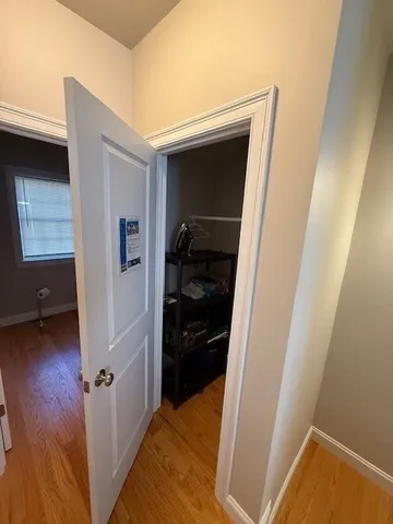 a bedroom with a bed and a walk in closet