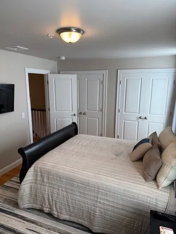 a bedroom with bed and window