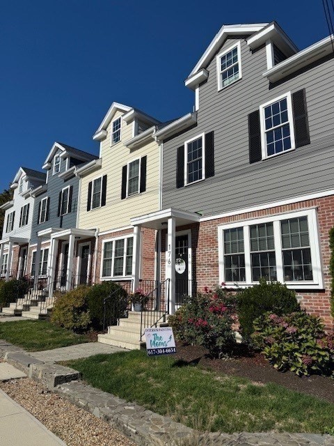 176 Main Street, Unit 3 Medway, MA 02053 - Photo 2 of 26 a front view of a house with a yard