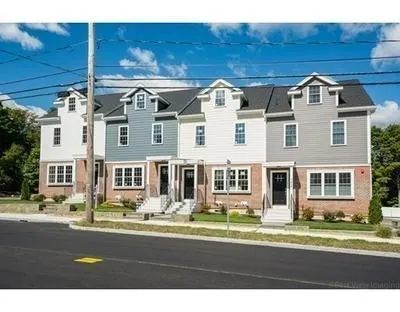 a front view of a building with a street