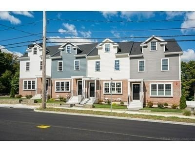 176 Main Street, Unit 3 Medway, MA 02053 - Photo 3 of 26 a front view of a building with a street