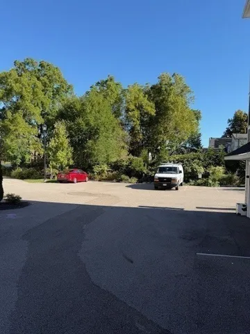 a view of road with view of a road and trees
