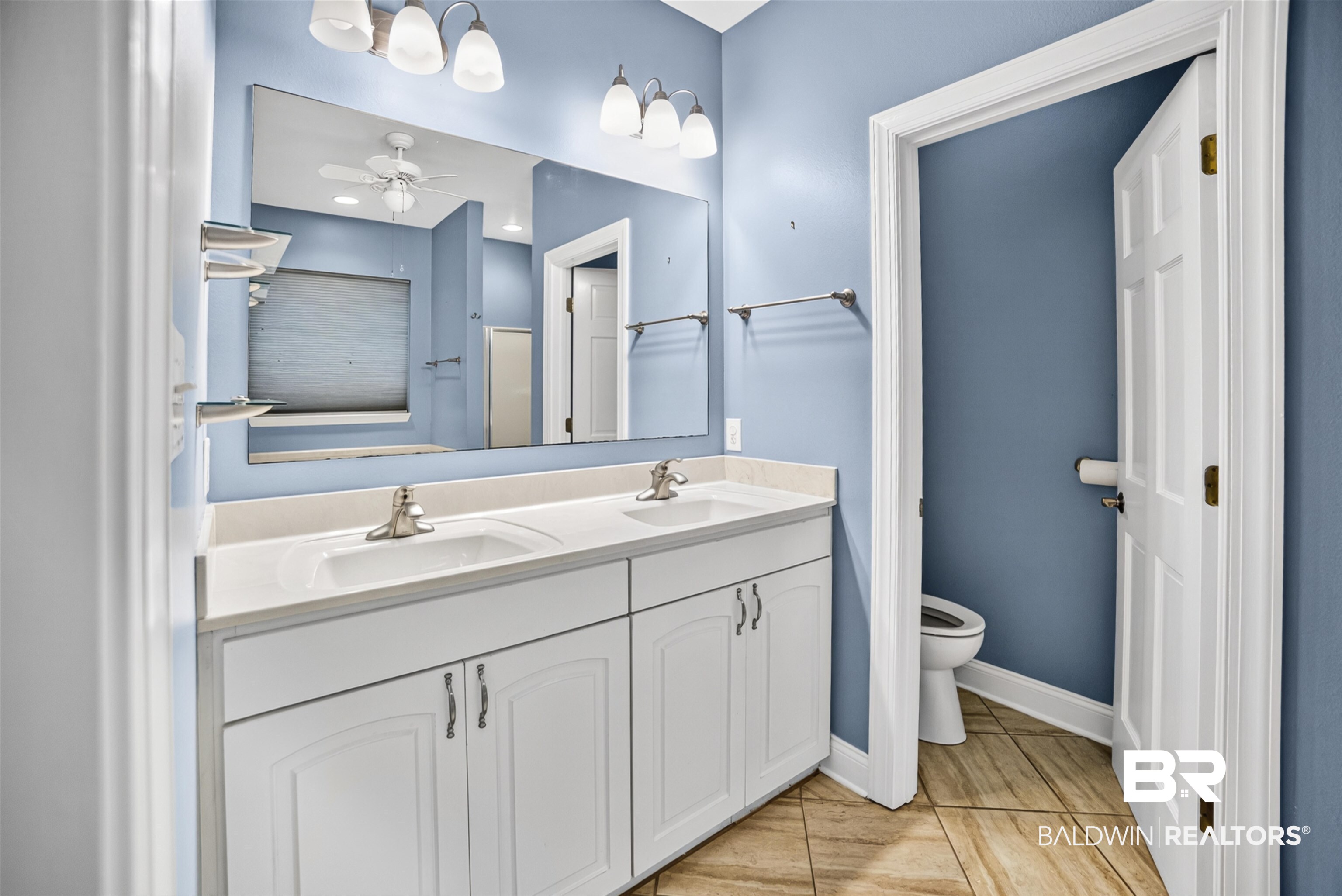 5913 Antoine Road Mobile, AL 36693 - Photo 15 of 33 Bathroom featuring a dual vanity with white cabinetry, light-toned countertops, and brushed nickel faucets