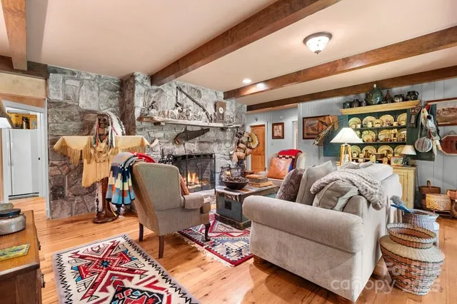 a view of a hallway with couch and dining area