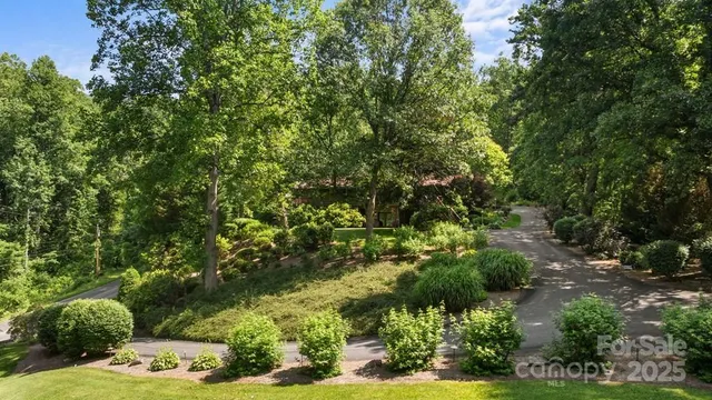 a view of a house with a yard and plants
