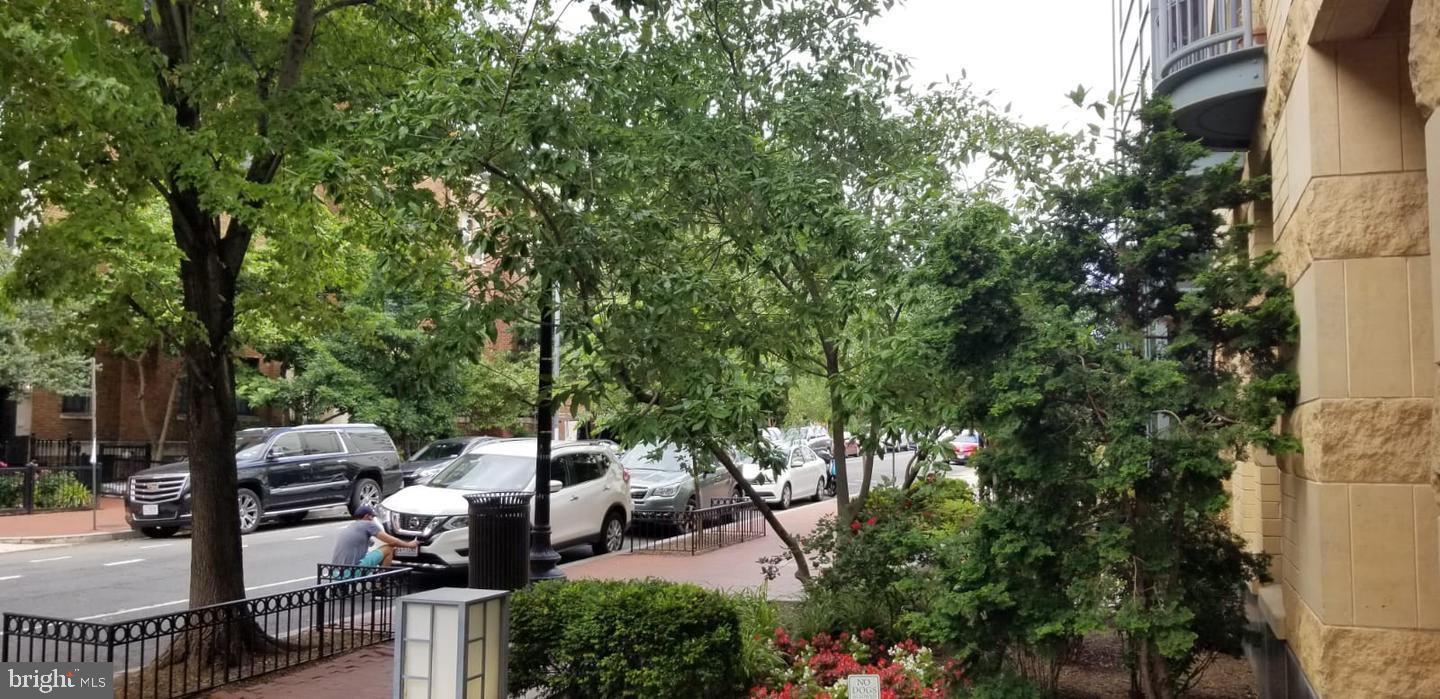 1117 10th Street Northwest, Unit 210 Washington, DC 20001 - Photo 13 of 15 a view of a patio with table and chairs and potted plants