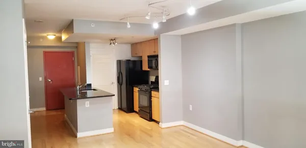a view of a kitchen with a sink