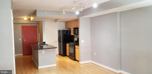 a view of a kitchen with a sink