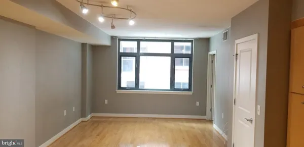 a view of an empty room with a window