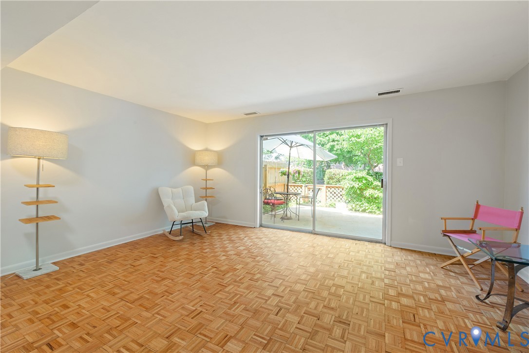 9129 Derbyshire Road, Unit E Henrico, VA 23229 - Photo 12 of 36 Spacious interior room featuring parquet wood-fini
