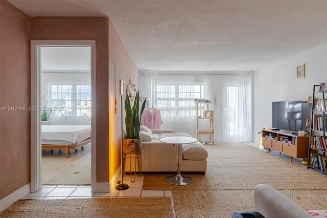 a bedroom with furniture and a window
