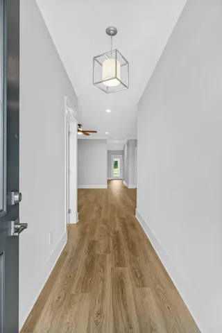 wooden floor in an empty room with a mirror