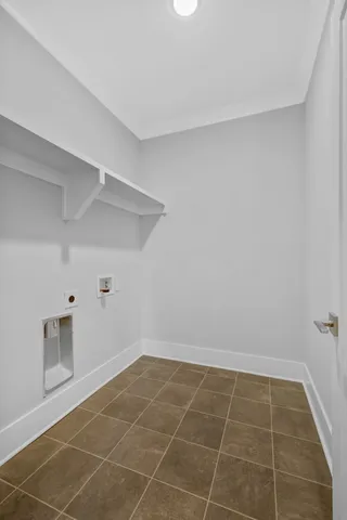 a view of a room with an empty space and a window