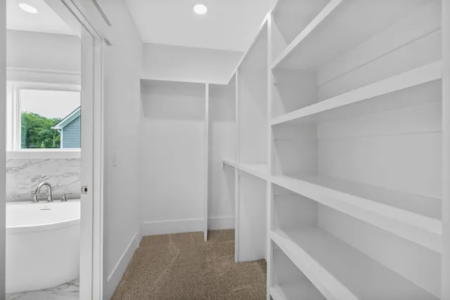 a view of an empty walk in closet
