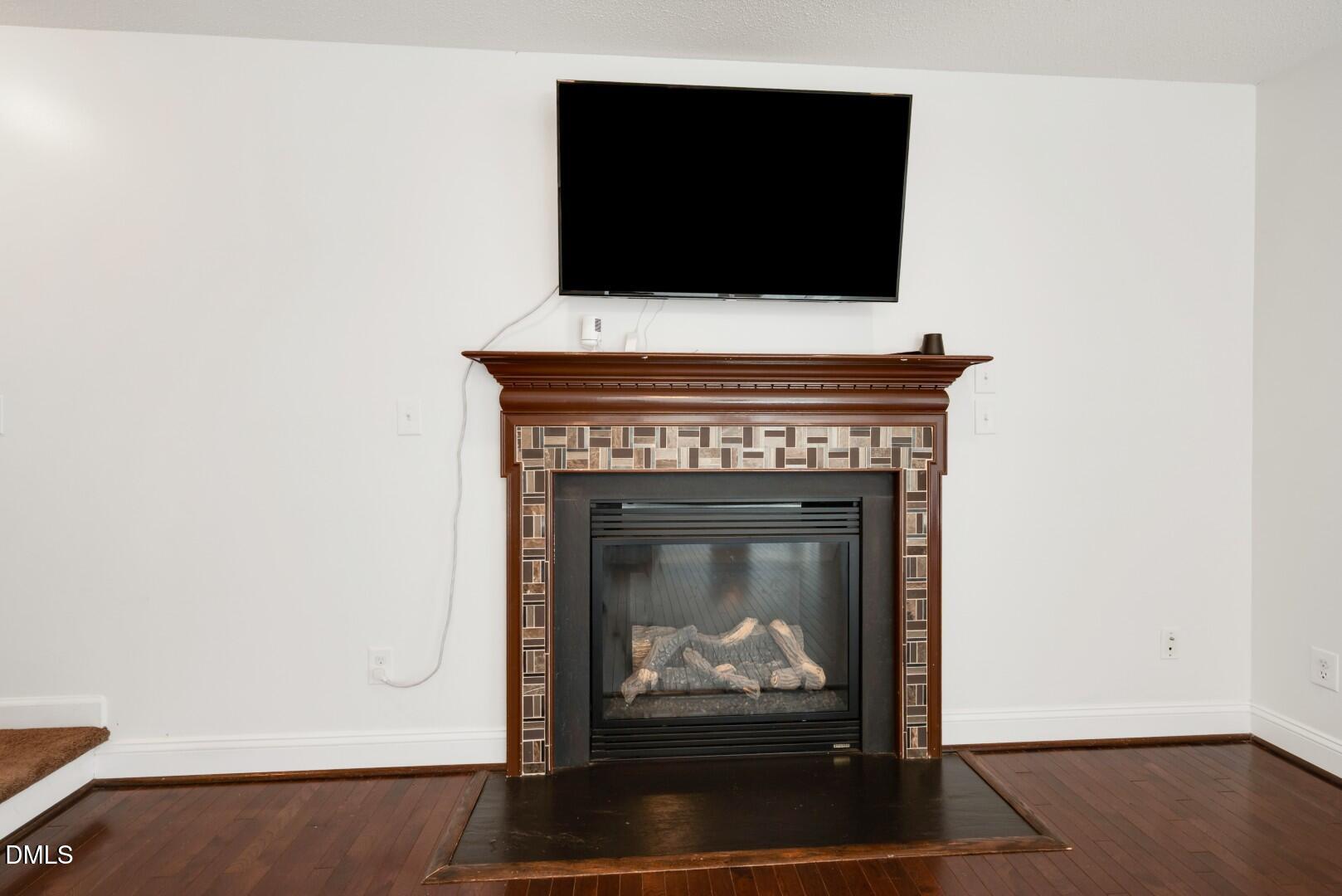 66 Snowden Lane Cameron, NC 28326 - Photo 10 of 55 a living room with a fireplace and a flat screen tv