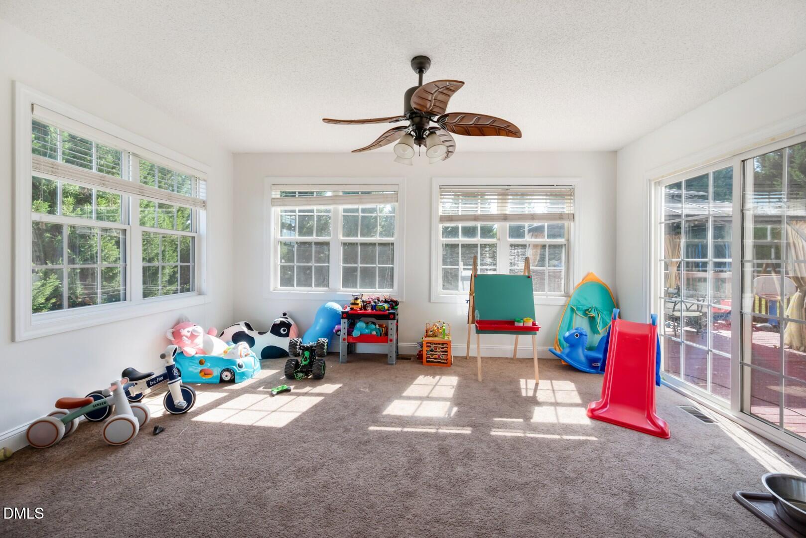 66 Snowden Lane Cameron, NC 28326 - Photo 11 of 55 a living room filled with furniture and a potted plant