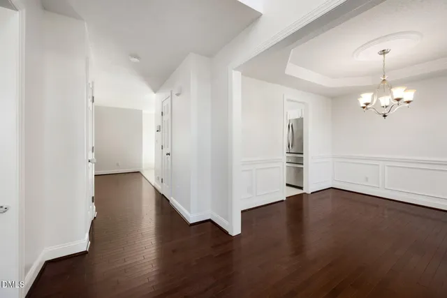 a view of an empty room with windows