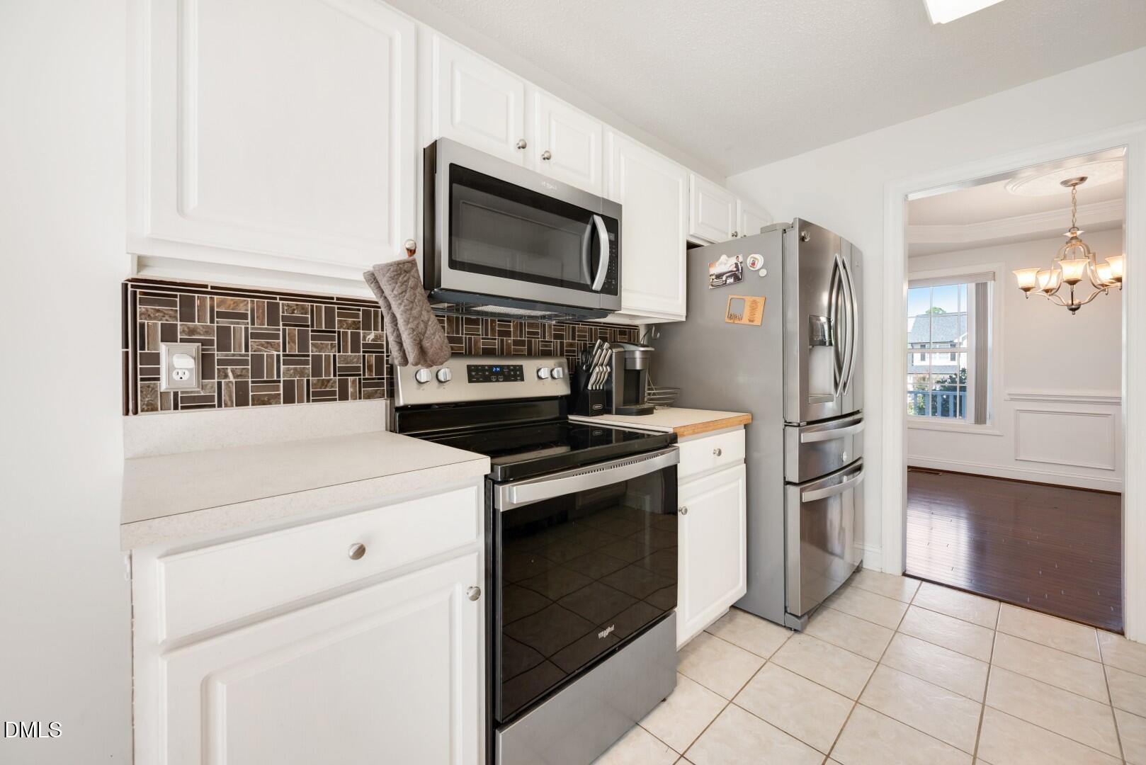 66 Snowden Lane Cameron, NC 28326 - Photo 17 of 55 a kitchen with a stove microwave and refrigerator
