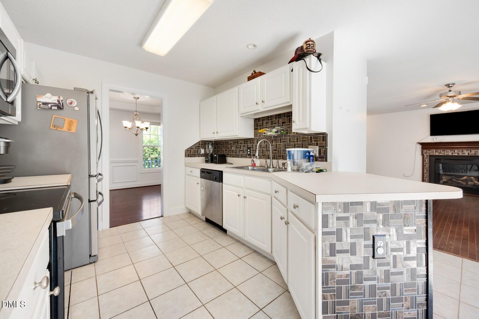 66 Snowden Lane Cameron, NC 28326 - Photo 18 of 55 a kitchen with cabinets appliances and a counter top space