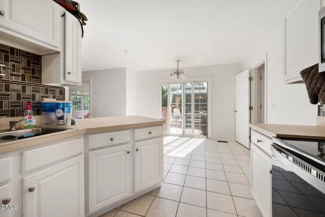 a kitchen with cabinets appliances and a counter top space