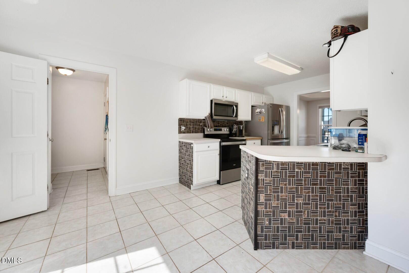 66 Snowden Lane Cameron, NC 28326 - Photo 20 of 55 a kitchen with cabinets and window