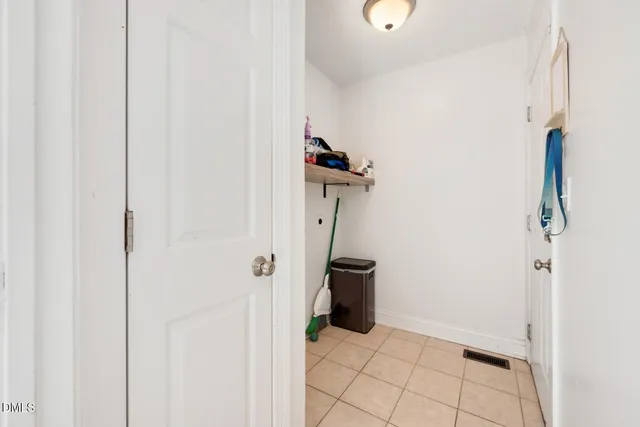 a spacious bathroom with a sink and a mirror