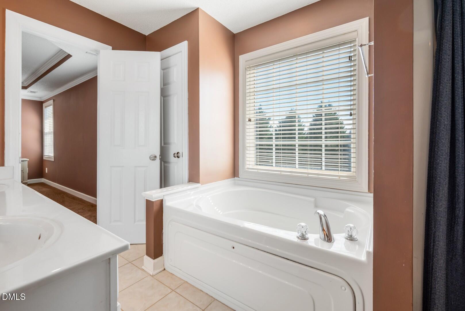 66 Snowden Lane Cameron, NC 28326 - Photo 30 of 55 a en suite bathroom with a granite countertop tub and a sink