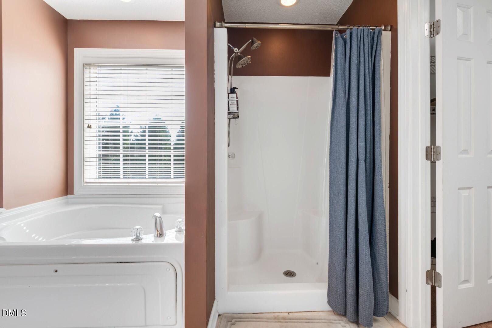 66 Snowden Lane Cameron, NC 28326 - Photo 31 of 55 a bathroom with a bathtub and a shower