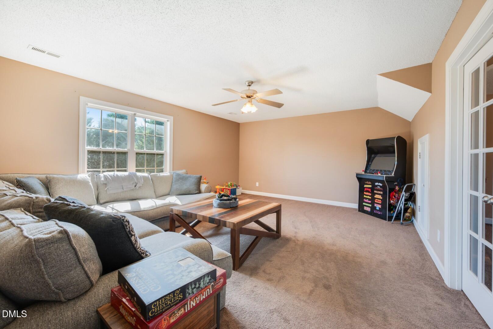 66 Snowden Lane Cameron, NC 28326 - Photo 39 of 55 a living room with furniture a window and a flat screen tv