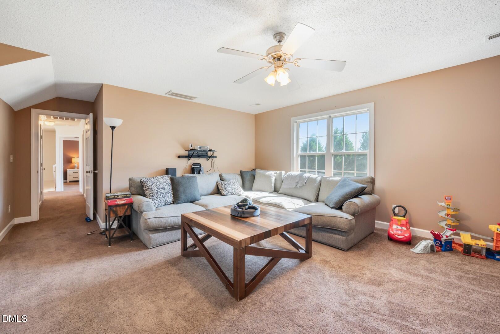 66 Snowden Lane Cameron, NC 28326 - Photo 40 of 55 a living room with furniture and a chandelier