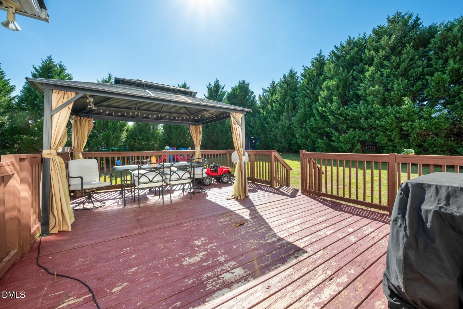 66 Snowden Lane Cameron, NC 28326 - Photo 43 of 55 a view of a deck with wooden floor and outdoor seating