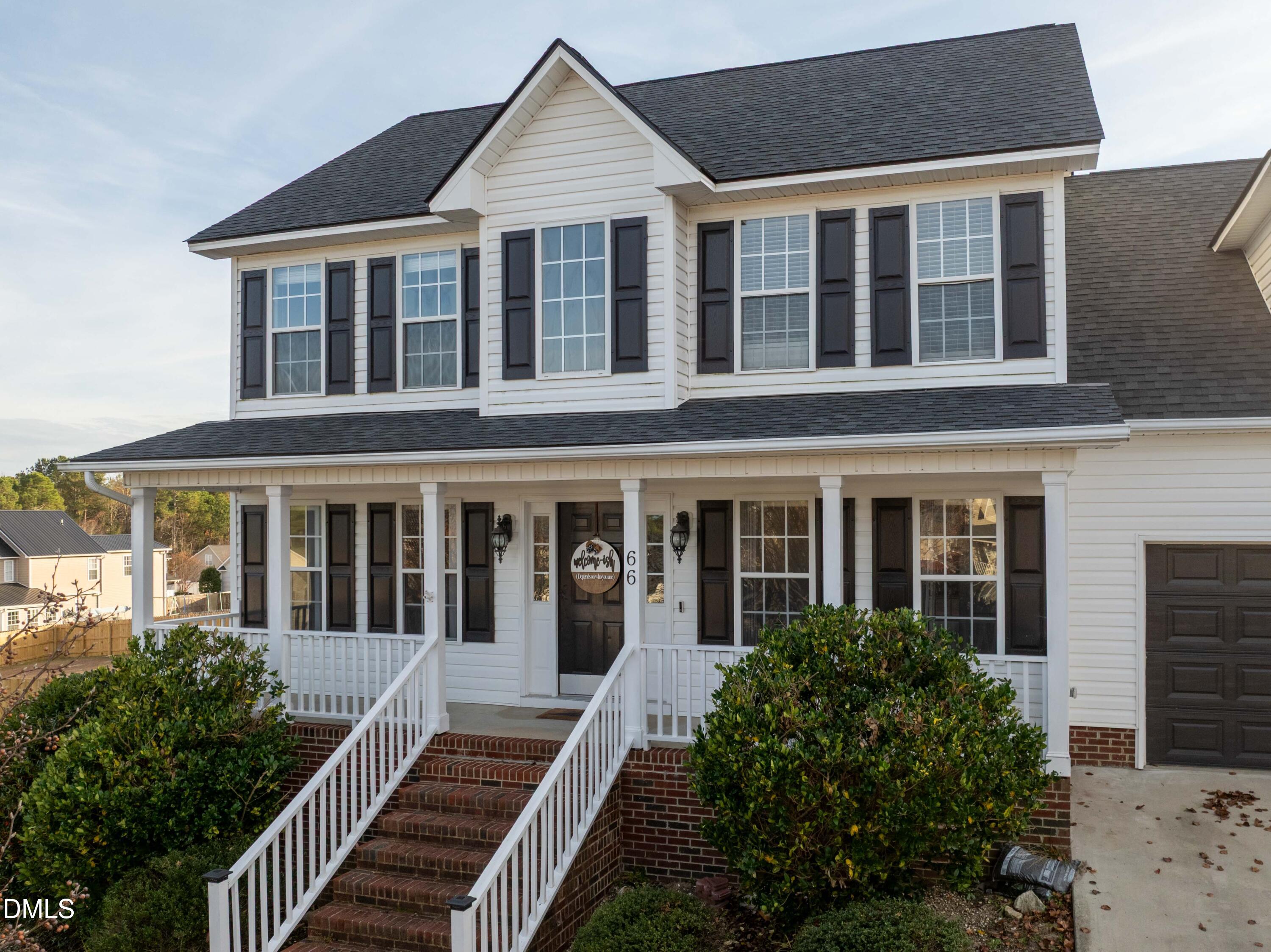 66 Snowden Lane Cameron, NC 28326 - Photo 46 of 55 front view of a brick house with large windows