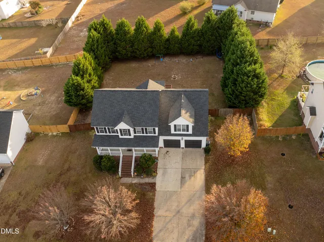 an aerial view of a house with a garden