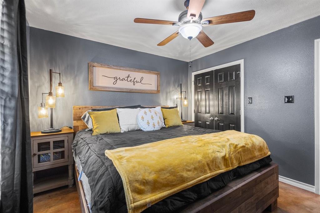 202 Spring Valley Queen City, TX 75572 - Photo 20 of 35 Bedroom with a textured wall, a closet, and a ceiling fan