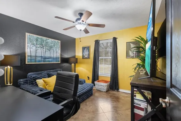 a living room with furniture and a window