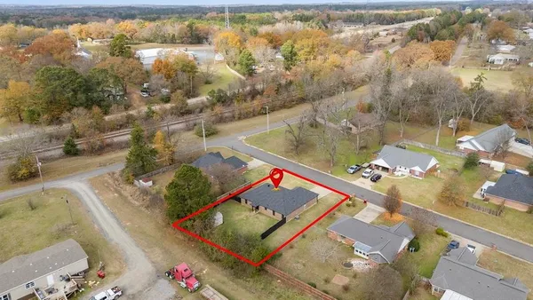 an aerial view of a residential houses with outdoor space