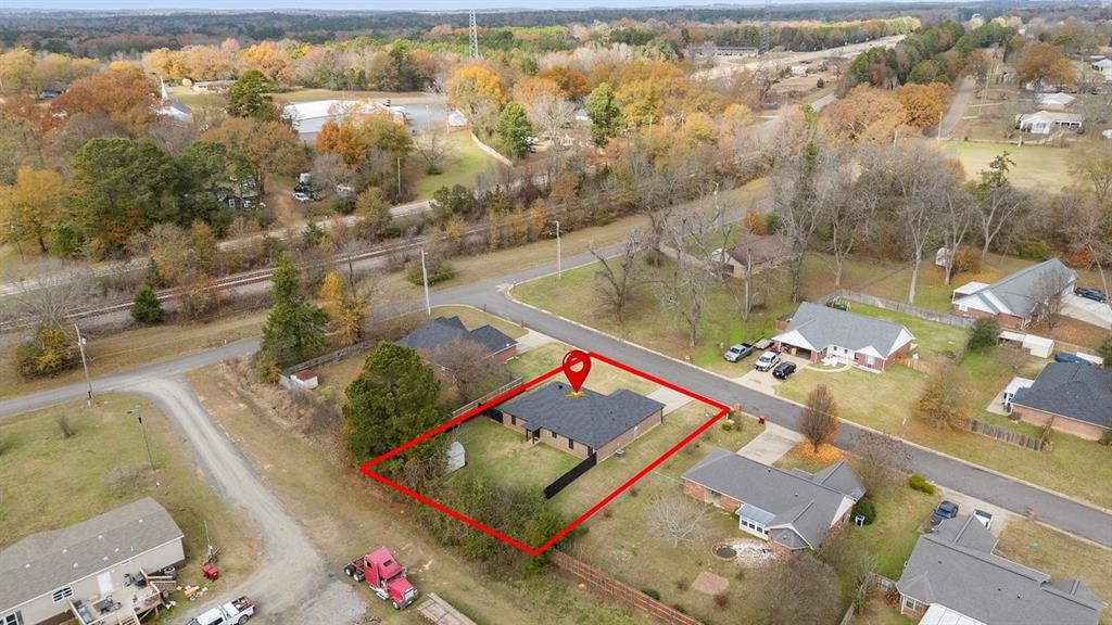 202 Spring Valley Queen City, TX 75572 - Photo 29 of 35 Aerial view of residential area with property parcel outlined