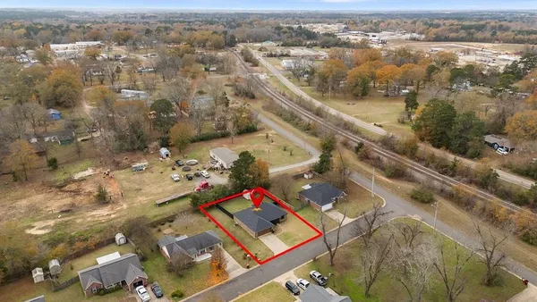 an aerial view of residential houses with outdoor space