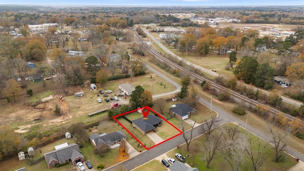 202 Spring Valley Queen City, TX 75572 - Photo 32 of 35 Aerial overview of property's location with property boundaries highlighted and a tree filled landscape
