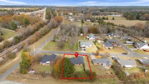 an aerial view of residential houses with outdoor space